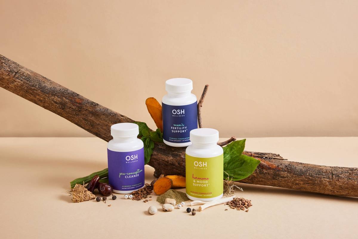 Ayurvedic supplements in a studio setting with natural props and ingredients around them from oshwellness.com